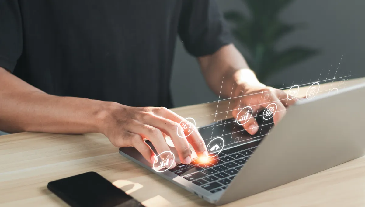 A person working at a laptop.